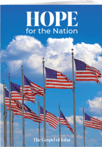 Several American flags waving on flagpoles against a blue sky with white clouds. The text at the top reads 